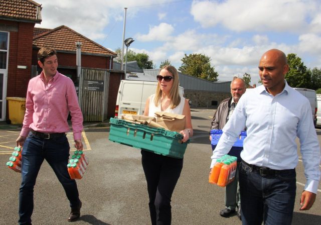 Mayor of Bristol, Marvin Rees and Feeding Bristol staff carrying food